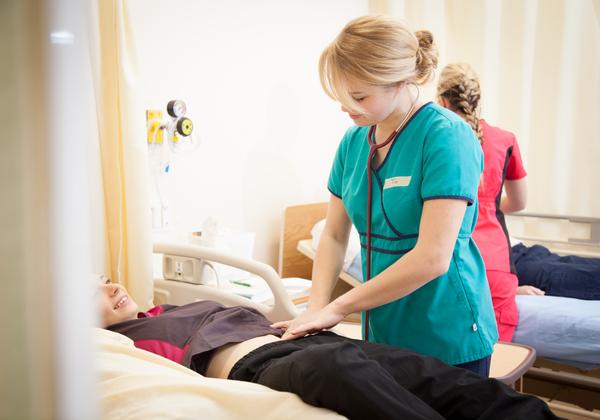 Nursing student practicing